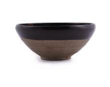 A russet-splashed brown glazed bowl