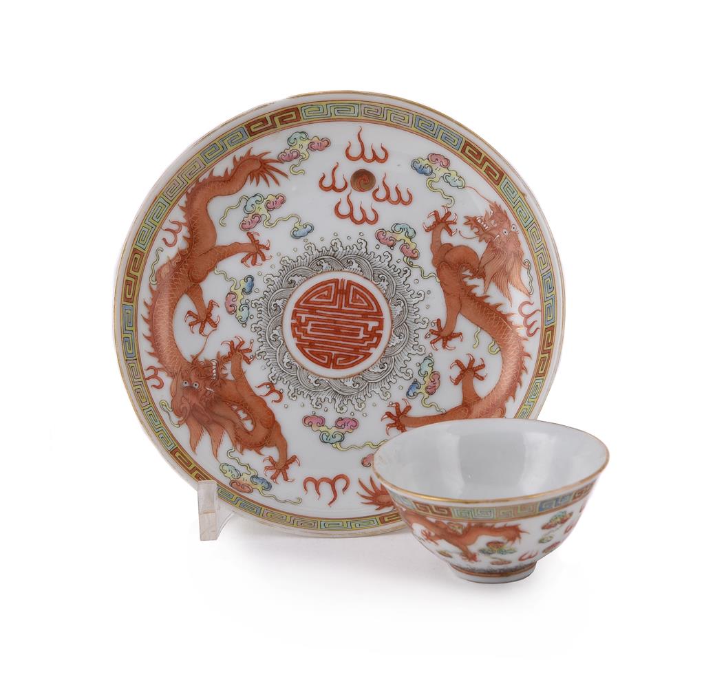 An iron-red 'dragon' saucer and a tea bowl