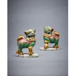 A pair of Chinese glazed biscuit Buddhist lion joss-stick holders
