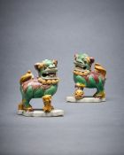 A pair of Chinese glazed biscuit Buddhist lion joss-stick holders