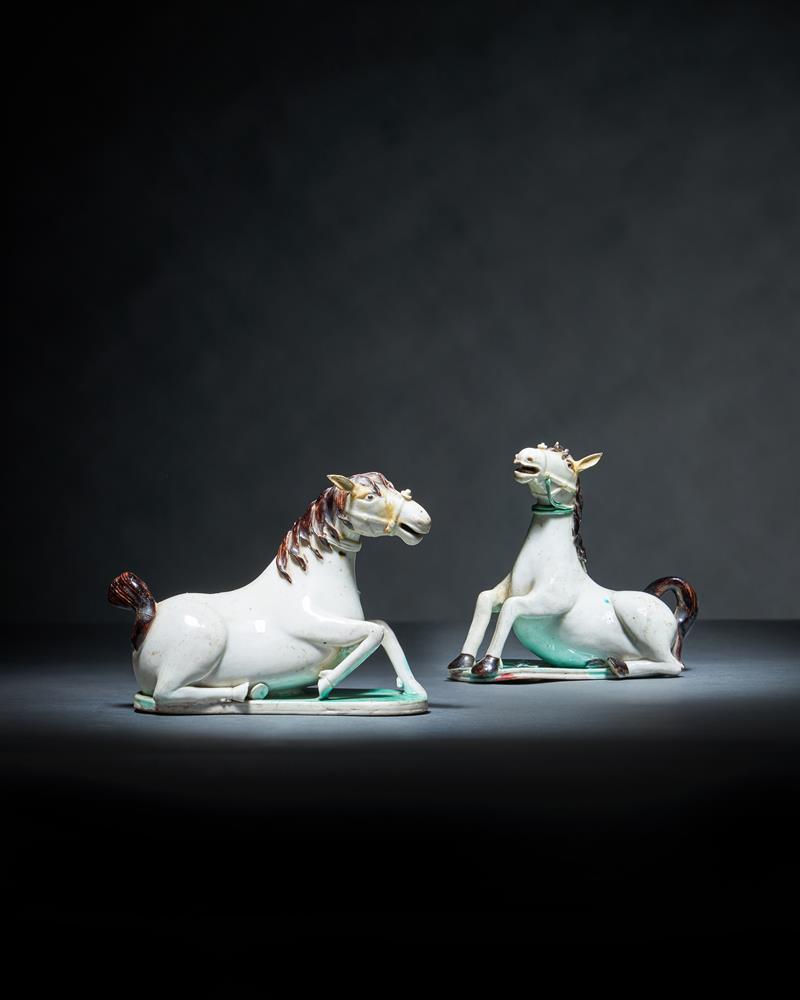 A rare pair of Chinese white glazed figures of horse water droppers