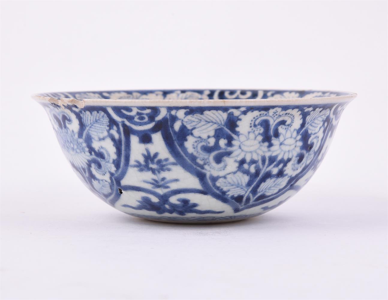 A Chinese blue and white soft-paste 'flower' bowl - Image 2 of 4