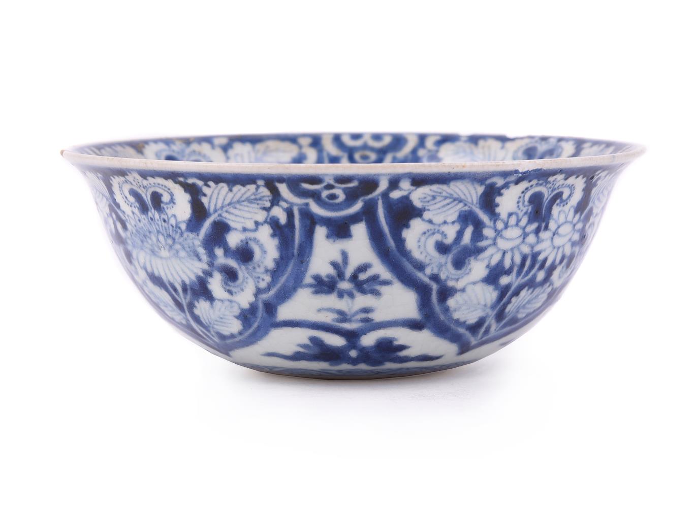 A Chinese blue and white soft-paste 'flower' bowl