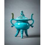 A Chinese turquoise glazed tripod censer and cover