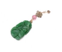 A Chinese green jade 'Monkey and Fruit' pendant