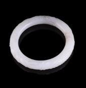 A Chinese white jade carved bangle