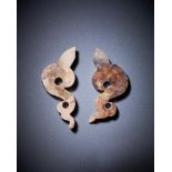 A pair of Chinese calcified jade bird-form pendants