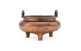 A large Chinese bronze twin-handled tripod censer