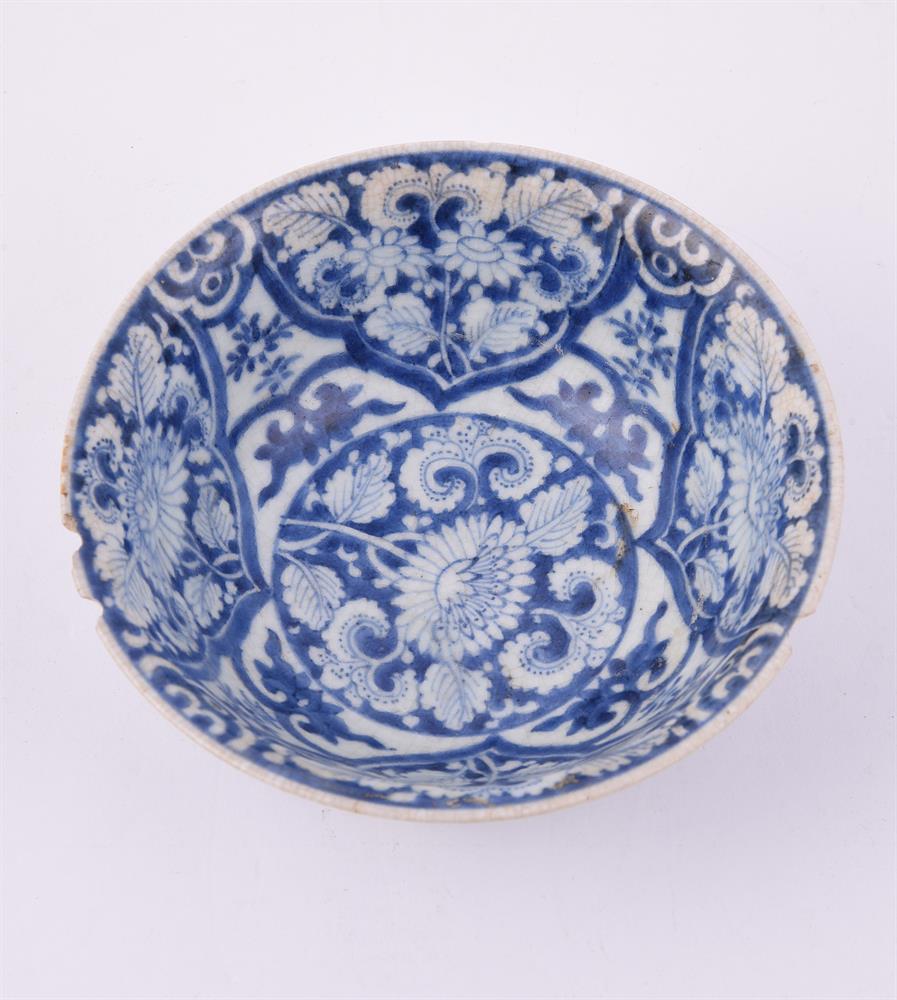 A Chinese blue and white soft-paste 'flower' bowl - Image 3 of 4