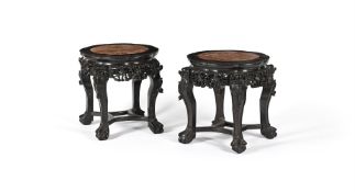 A pair of Chinese Hongmu and marble topped stands