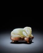 A Chinese pale celadon small jade carving of a horse