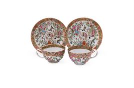 A pair of Cantonese tea cups and saucers
