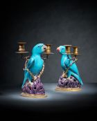 A fine pair of Chinese gilt-metal mounted biscuit porcelain parrot candelabra