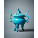 A Chinese turquoise glazed tripod censer and cover