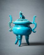 A Chinese turquoise glazed tripod censer and cover