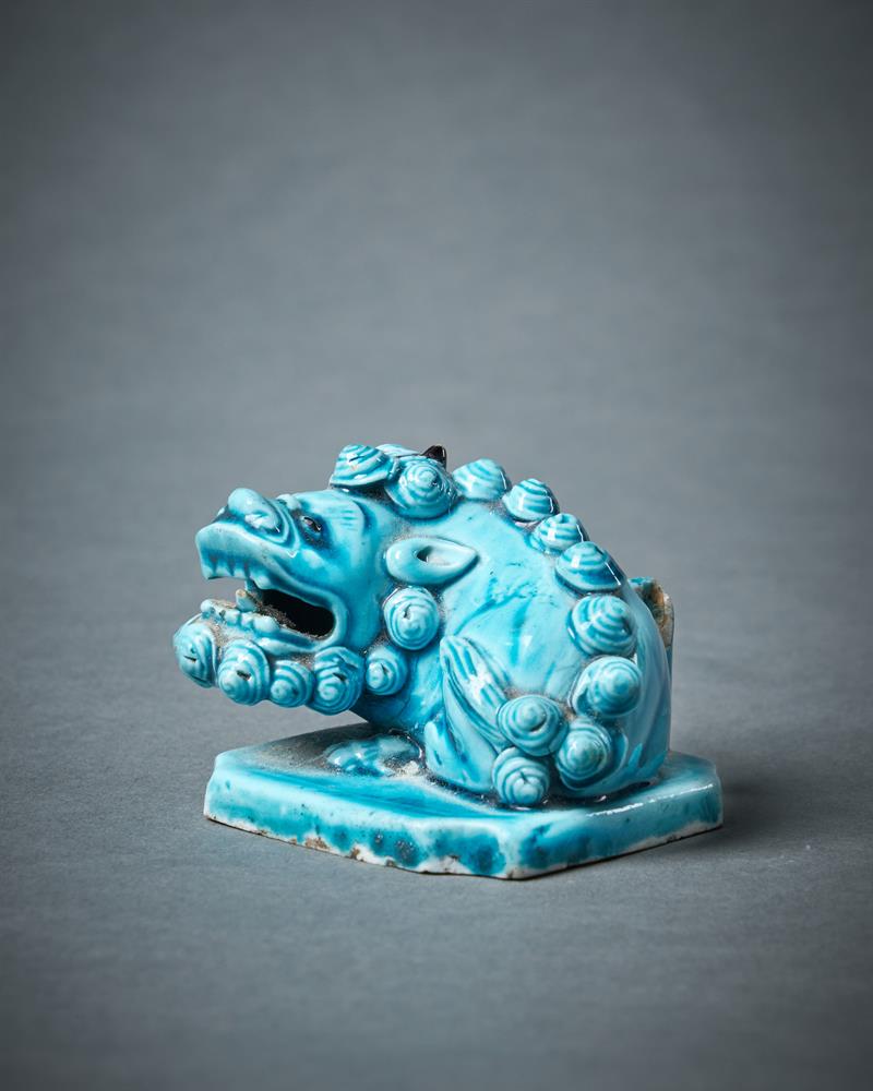 A Chinese turquoise glazed model of a Buddhist Lion joss stick holder