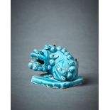 A Chinese turquoise glazed model of a Buddhist Lion joss stick holder