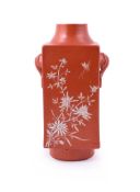 A Chinese coral red square cong vase