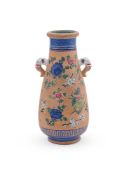 A Chinese enamelled yixing twin handled vase