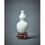A Chinese small white glazed double-gourd porcelain vase