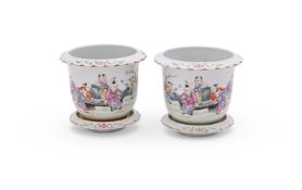 A pair of Chinese Famille Rose 'boys' small jardinières and stands