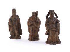 Three Chinese cast-iron models of Deities