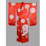 A very elaborate bright red shaded Japanese wedding Kimono