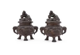A pair of Japanese bronze censers and covers