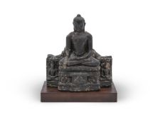 An Early Pala Black Basalt Figure of Buddha