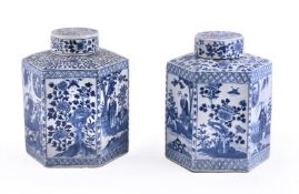 A pair of Chinese blue and white hexagonal tea caddies and covers