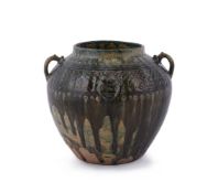 A Chinese twin handled green pottery jar