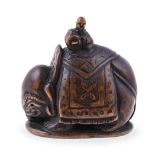 Hara Shumin: A Japanese Boxwood Netsuke depicting a richly caparisoned elephant