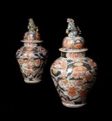 A pair of Japanese Imari vases and covers