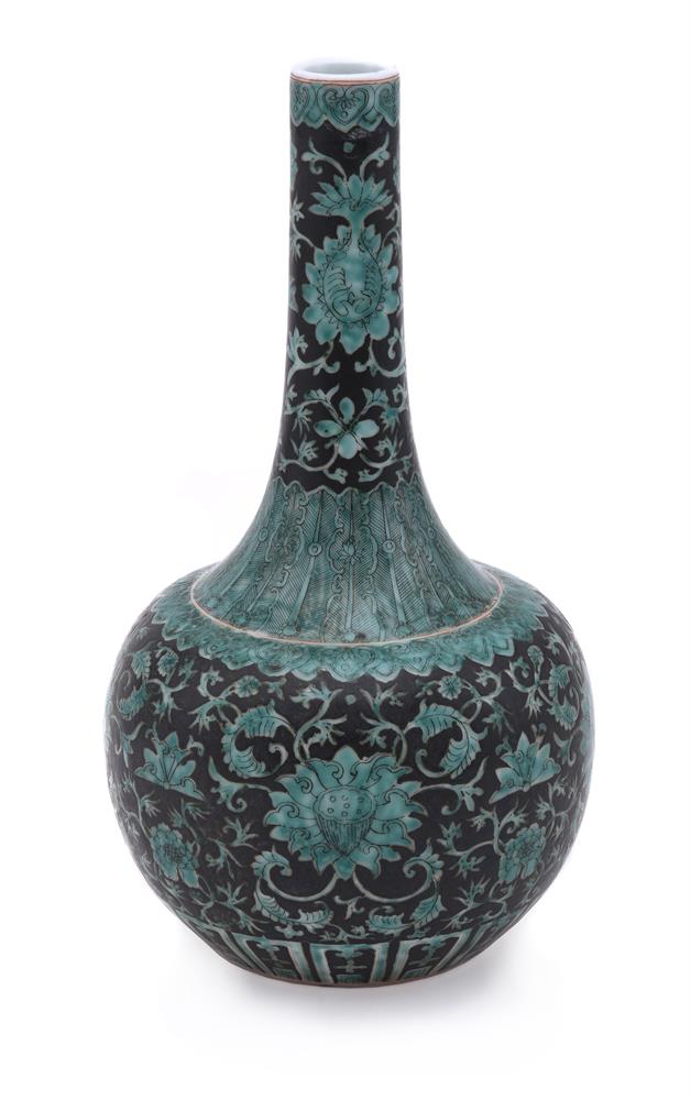 A Chinese green and black glazed bottle vase