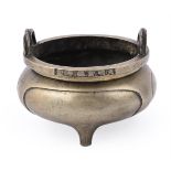 A Chinese bronze tripod censer