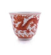 A Chinese iron red 'Dragons' wine cup