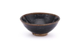 A Chinese black-glazed conical tea bowl