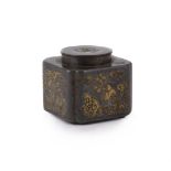 A Chinese brass inlaid pewter inkwell and cover