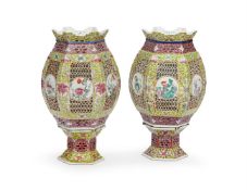 A pair of Chinese Famille Rose pierced lanterns and fixed stands