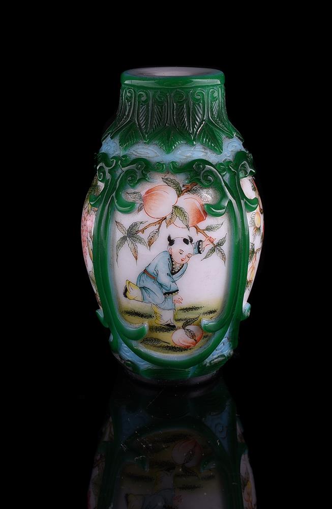 A green and blue glass overlay snuff bottle