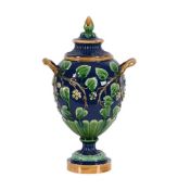 A MINTON MAJOLICA TWIN HANDLED URN AND COVER