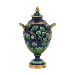 A MINTON MAJOLICA TWIN HANDLED URN AND COVER