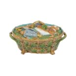 A MINTON MAJOLICA TWO HANDLES OZIER MOULDED GAME PIE TUREEN AND COVER