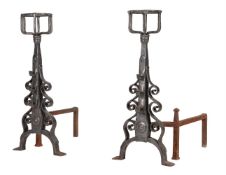 A PAIR OF WROUGHT IRON ANDIRONS, IN ARTS & CRAFTS TASTE