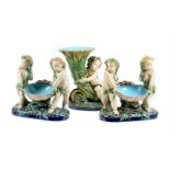 A PAIR OF MINTON MAJOLICA FIGURAL TABLE CENTREPIECES