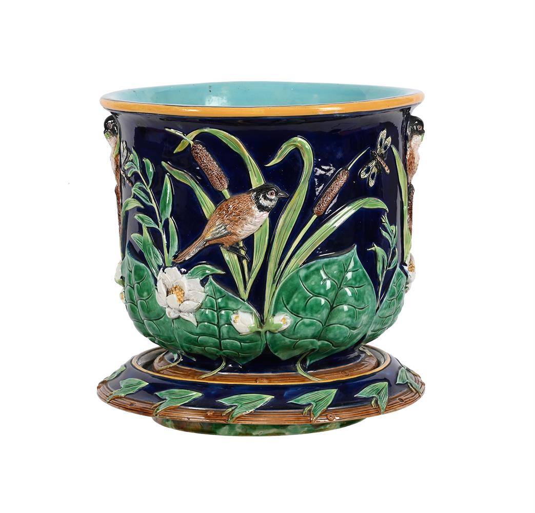 A GEORGE JONES MAJOLICA BLUE GROUND JARDINIERE AND STAND