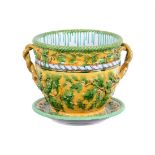 A LARGE MINTON MAJOLICA TWO HANDLED JARDINIERE AND STAND
