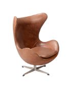 AFTER ARNE JACOBSEN, A BROWN LEATHER EGG CHAIR