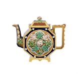 A BROWN-WESTHEAD MOORE & CO MAJOLICA TEAPOT AND COVER