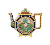A BROWN-WESTHEAD MOORE & CO MAJOLICA TEAPOT AND COVER
